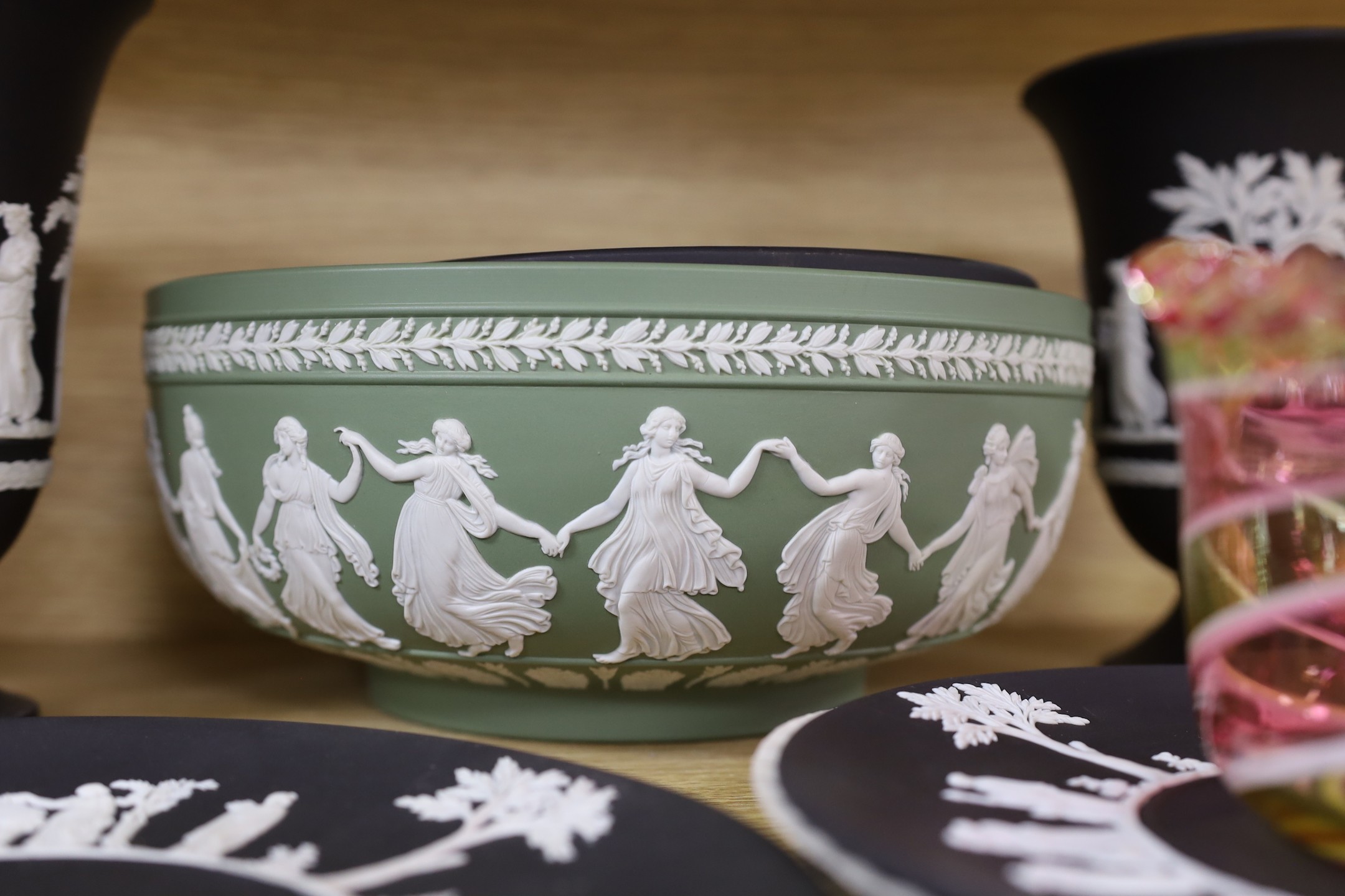 A Wedgwood black basalt pair vases, bowls, 3 plates and green bowl and glass bowl, vase 18 cms high